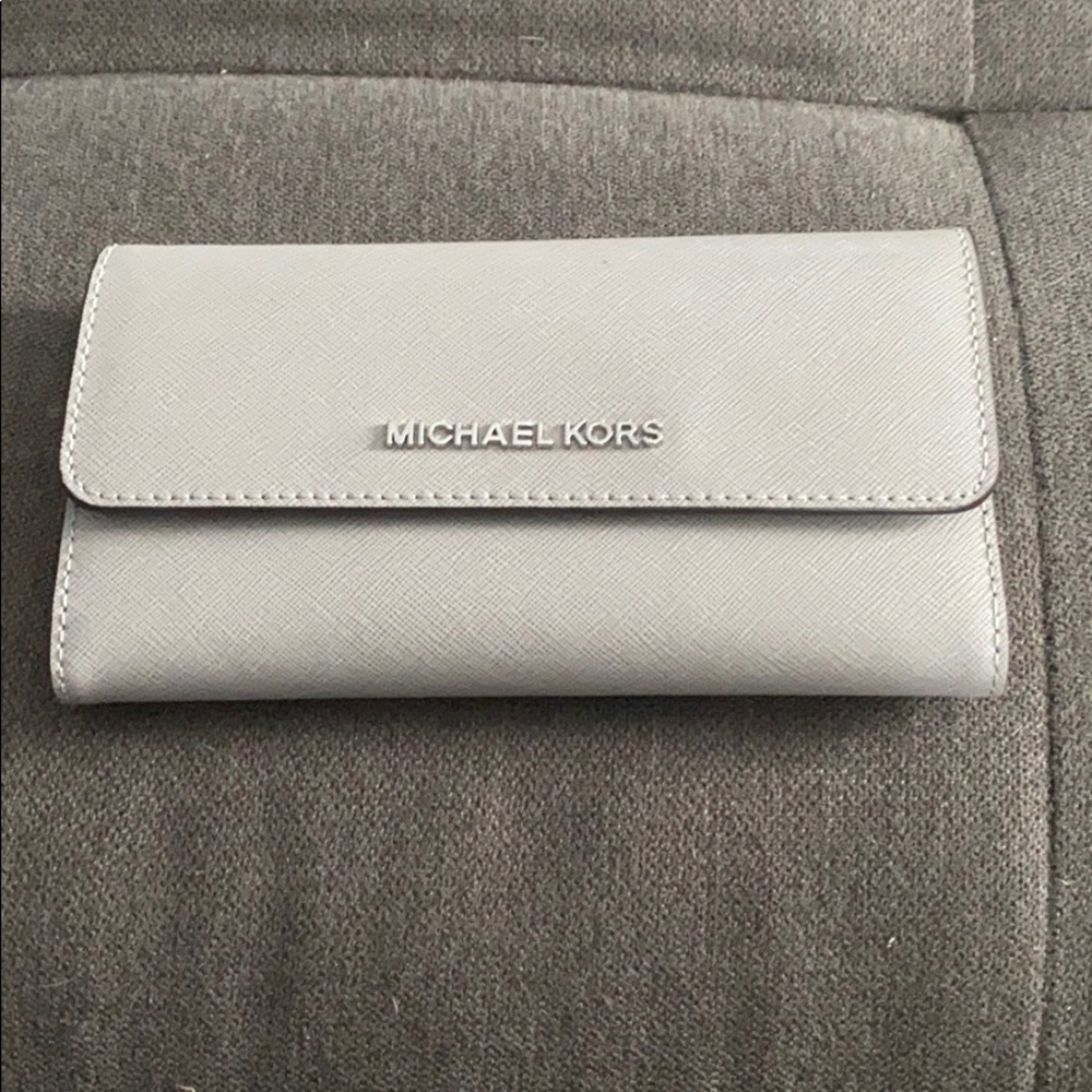 Gray Micheal Kors trifold wallet